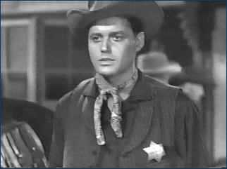 Guy Williams as sheriff Will Harrington